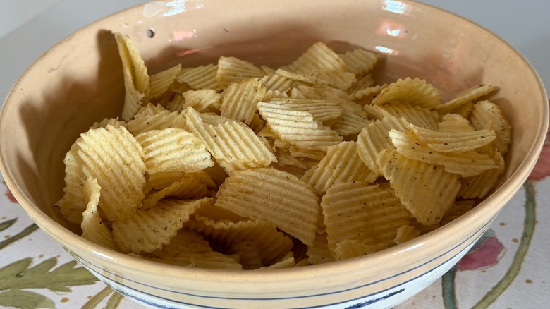 A bowl of Ruffles original potato chips