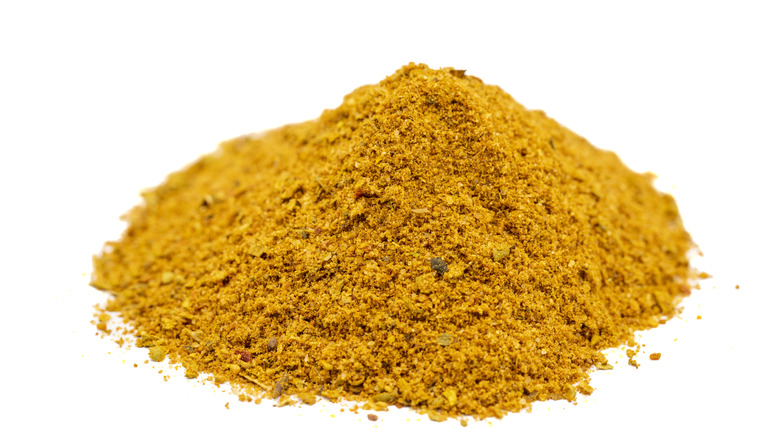 Powdered cajun spice isolated on white background