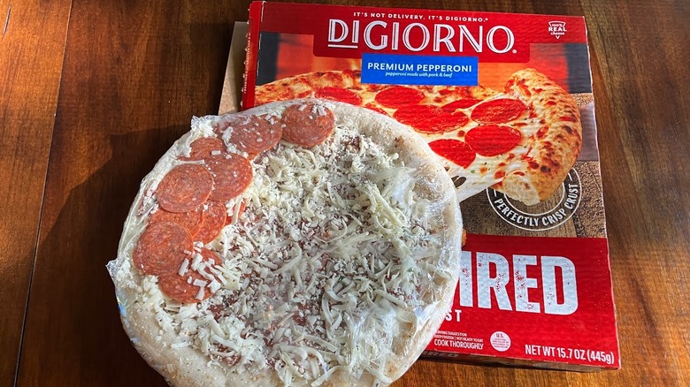 Frozen pepperoni pizza on top of a DiGiorno pizza box.