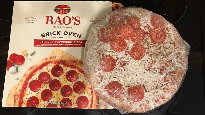 Frozen pepperoni pizza place next to a Rao's Made for Home pizza box.