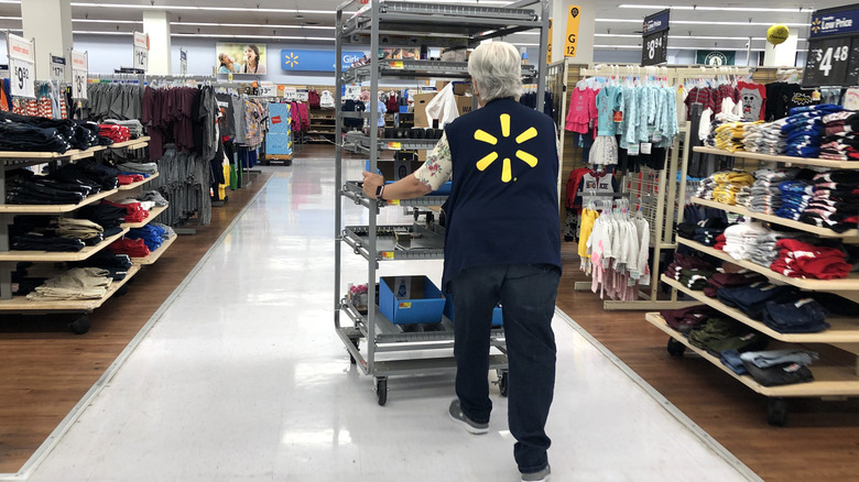 Walmart employee walking through store