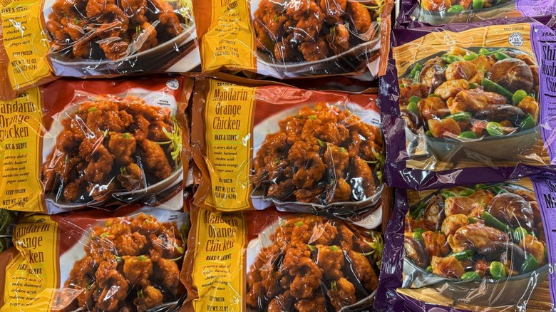 Bags of mandarin orange chicken in Trader Joe's freezer aisle