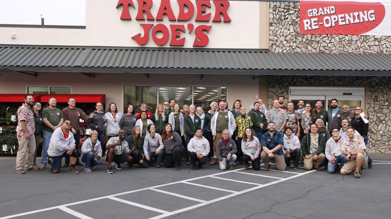 Trader Joe's staff poses together for a photo outside store on grand re-opening