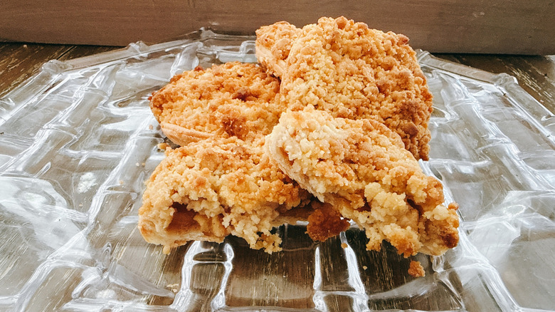 Pile of Trader Joe's teeny tiny apple pies on a glass plate