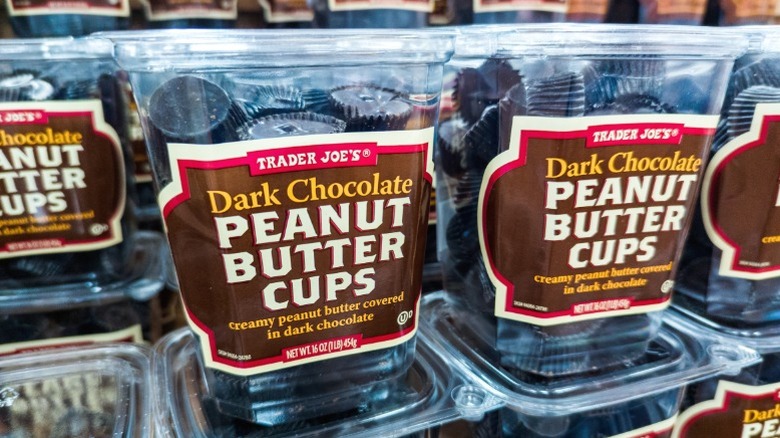 Containers of Trader Joe's Dark Chocolate Peanut Butter Cups on sale.