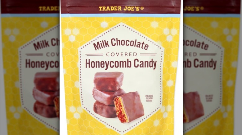 A bag of Trader Joe's Milk Chocolate Covered Honeycomb Candy on a white background.