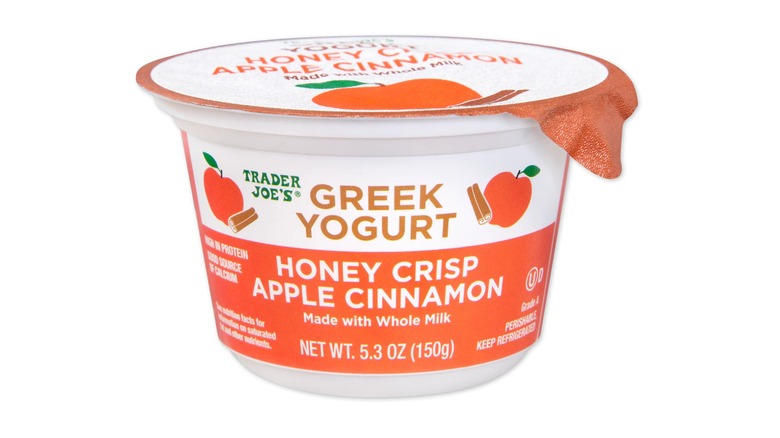 A container of Trader Joe's Honey Crisp Apple Cinnamon Greek Yogurt on a white background