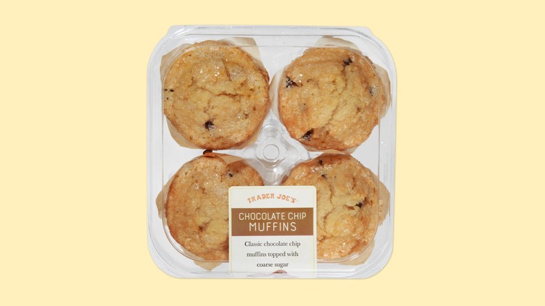 A container of the chocolate chip muffins from Trader Joe's on a yellow background.