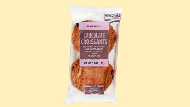 A two-pack of the chocolate croissants from Trader Joe's on a yellow background.