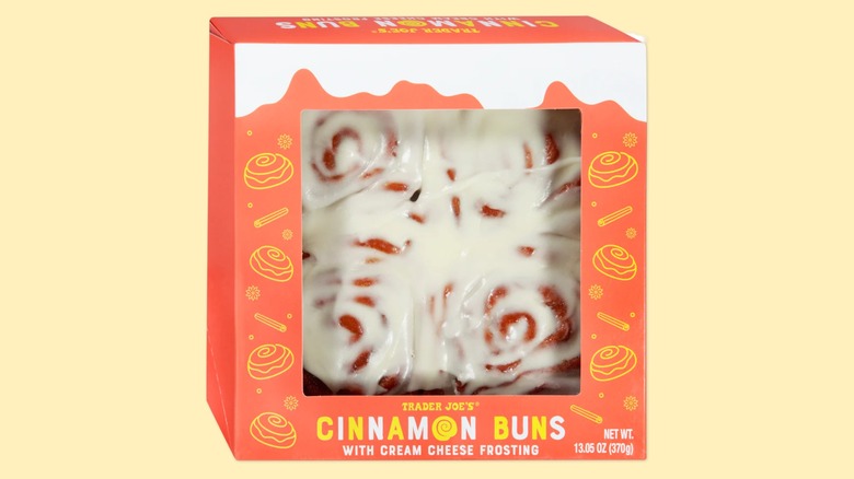 A box of the Cinnamon Buns from Trader Joe's on a yellow background.