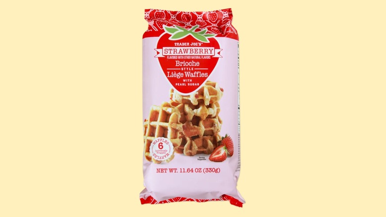 A bag of the Trader Joe's Strawberry Brioche Style Liège Waffles on a yellow background.