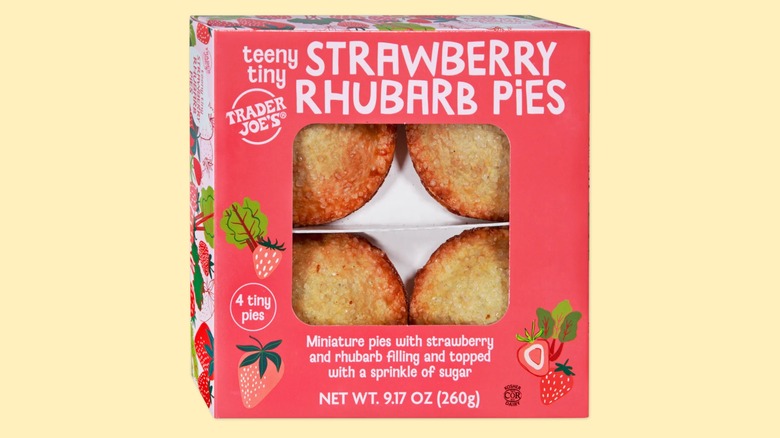 A box of the Teeny Tiny Strawberry Rhubarb Pies from Trader Joe's on a yellow background.