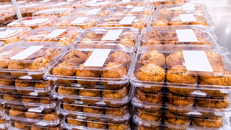 A selection of prepackaged muffins available at a grocery store bakery