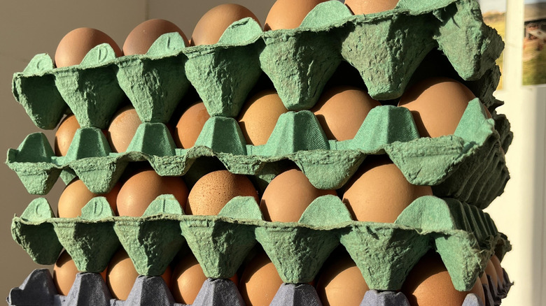 a stack of brown shelled eggs purchased in bulk for baking