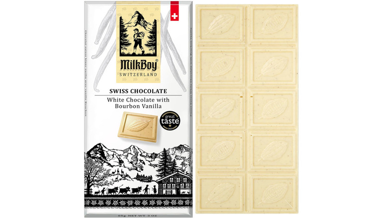 Wrapped and unwrapped bars of MilkBoy White Chocolate with Bourbon Vanilla on white background