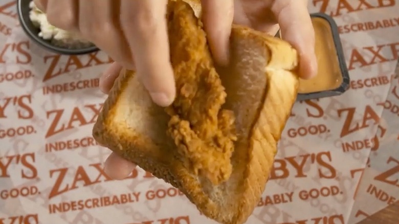 Hand holding Zaxby's Texas Toast Taco hack