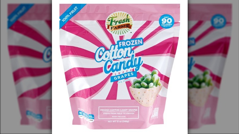 Bag of Aldi Fresh Farms Frozen Cotton Candy Grapes on a white background.