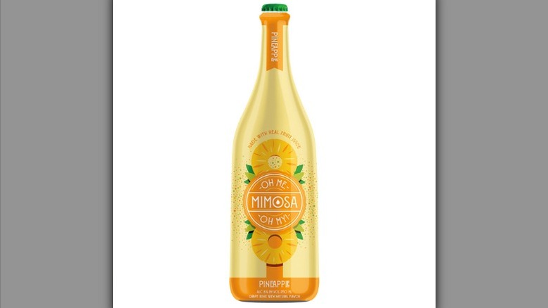 Bottle of Aldi Oh Me, Oh My! Pineapple Mimosa on a white background.