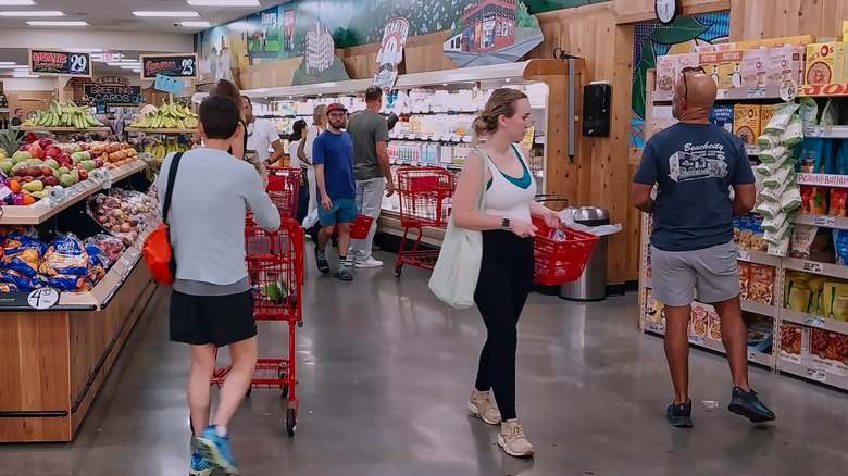 Customers walking around a Trader Joe's