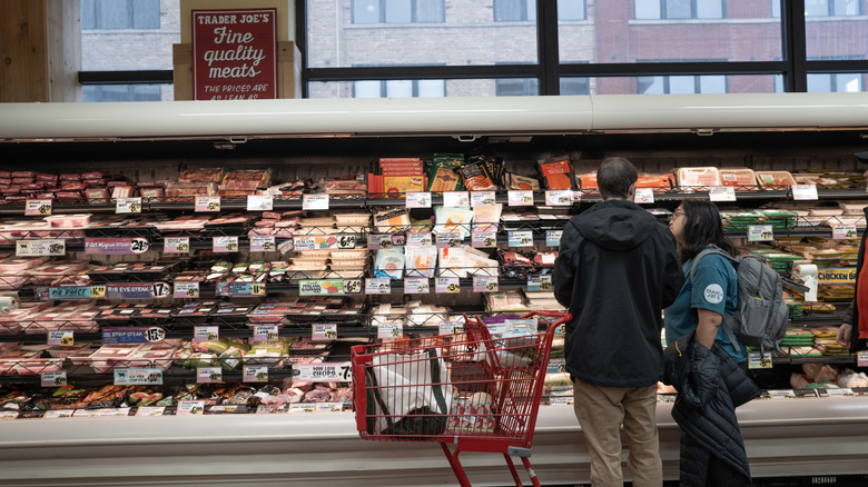 Customers shop at a Trader Joe's store