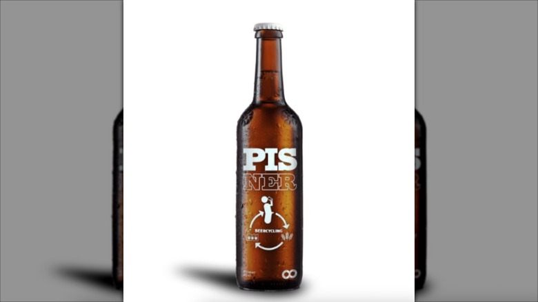 A bottle of Nørrebro Bryghus Pisner beer isolated on a white background