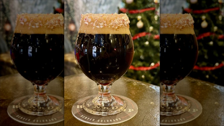 Glass of the iconic Rocky Mountain Oyster Stout with a festive twist of spearmint, peppermint, and chocolate