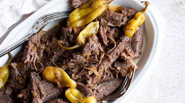 Homemade Slow Cooker Pot Roast with Pepperoncinis on a white platter
