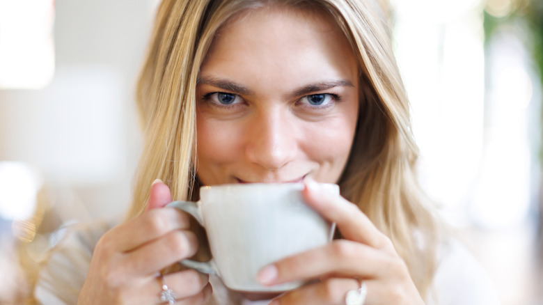Woman drinking a cup of coffee