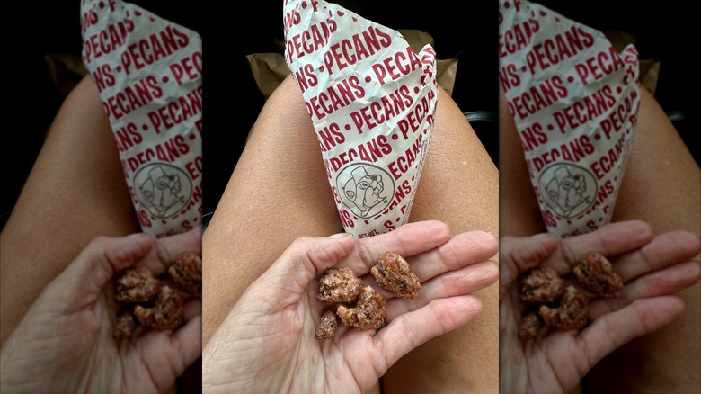 Hand holding Buc-ee's roast pecans