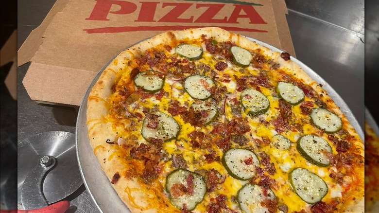 Pizza with zucchini next to pizza box at Bibb Street Pizza Company