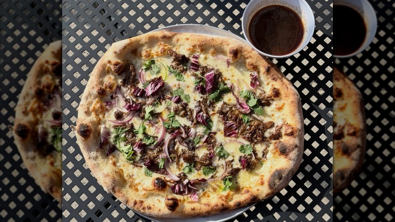 La Birria pizza with beef and red onions from King Dough restaurant