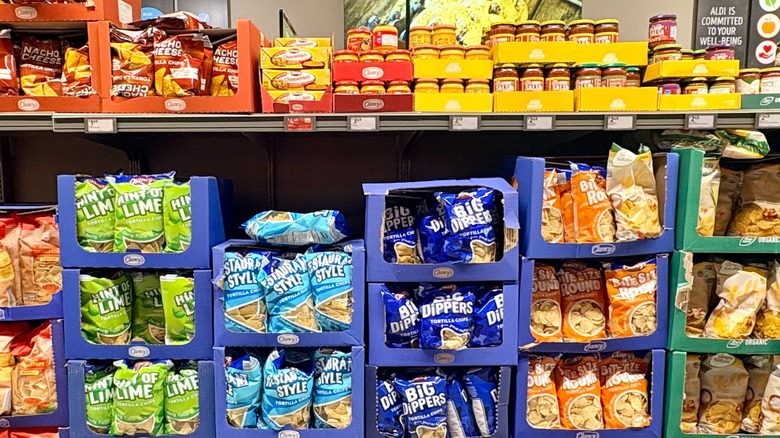 Tortilla chips and jars of salsa on Aldi store shelves