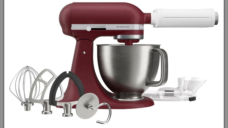 Dark red KitchenAid Artisan Plus 5-Quart Tilt-Head Stand Mixer with 3-in-1 Pasta Attachment and multiple other attachments on white background