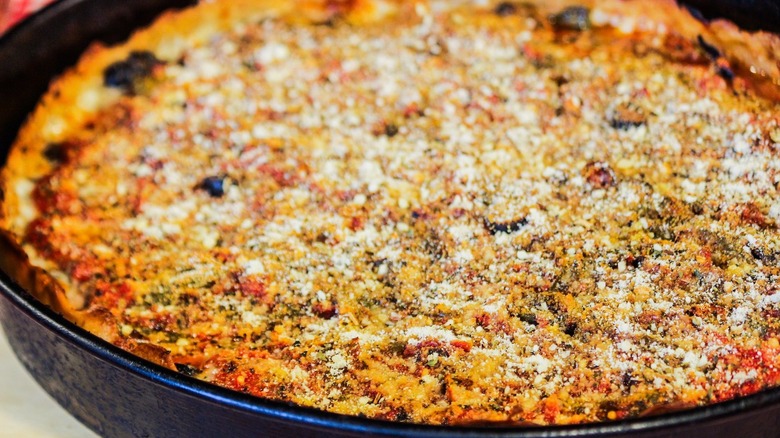 A Chicago-style pizza rests in its iron pan at Mr. G's Chicago Style Pizza