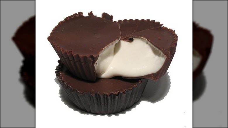 Valomilk candy split open with creamy center spilling out