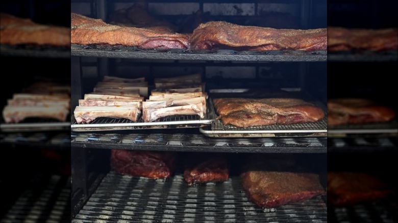 smoker loaded with oak-smoked brisket, chicken, bone marrow, and pork at Butchertown Hall