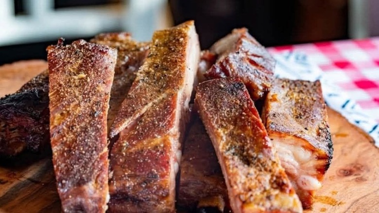 Seasoned barbecue ribs on table at Tex's World Famous Bar-B-Q