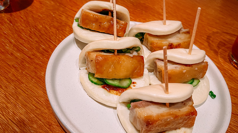 Pork Belly Bao Buns With Cucumber as an Appetizer in a Casual Restaurant