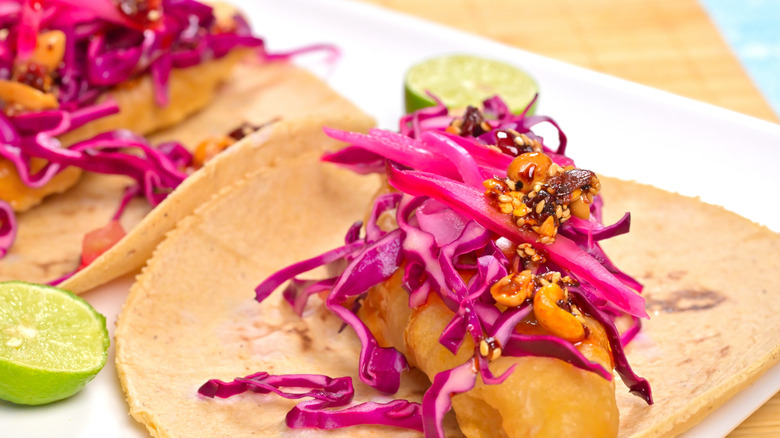 Fish tacos topped with purple cabbage
