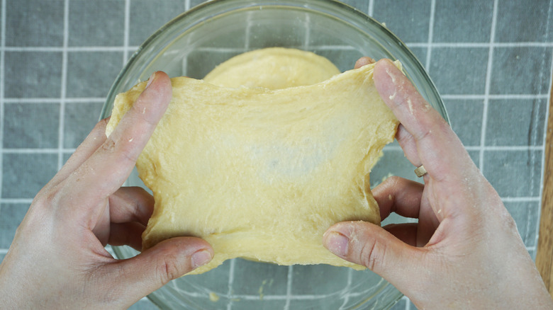 You can do windowpane test on the dough. It should be smooth and didn't tears apart when you stretch it