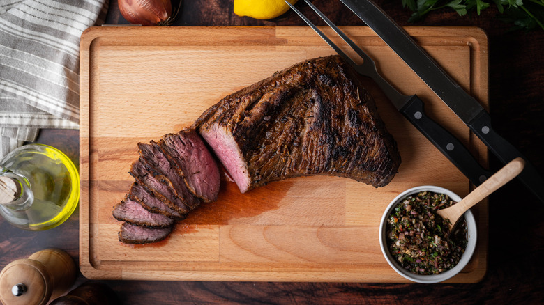 Tri tip steak on cutting board