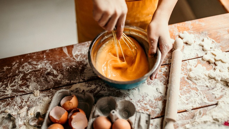 Chef shown whisking eggs