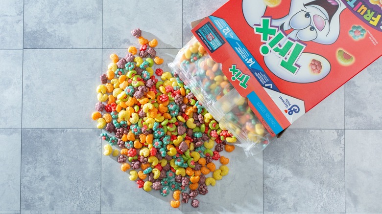 A top down view of a pile of Trix cereal spilling out of the package.
