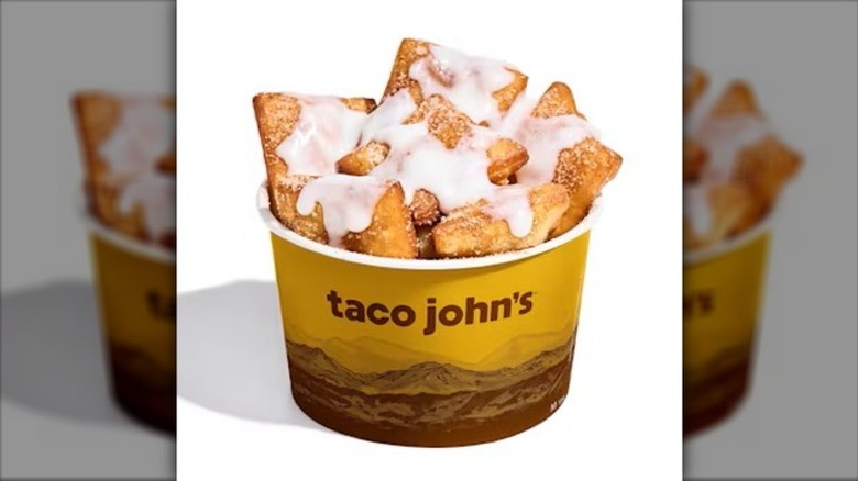 Taco John's Mexican Donut Bites in a yellow cardboard cup imprinted with the words "Taco John's" on a white background.