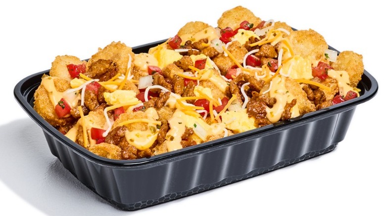 Taco John's Potato Olés Scrambler in a rectangular black plastic container on a white background.