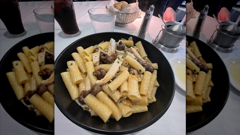 rigatoni with chicken and mushrooms in a cream sauce on table at Maggiano's Little Italy