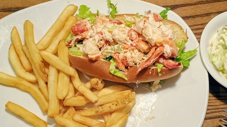 Colossal lobster roll with side of French fries at 99 Restaurants