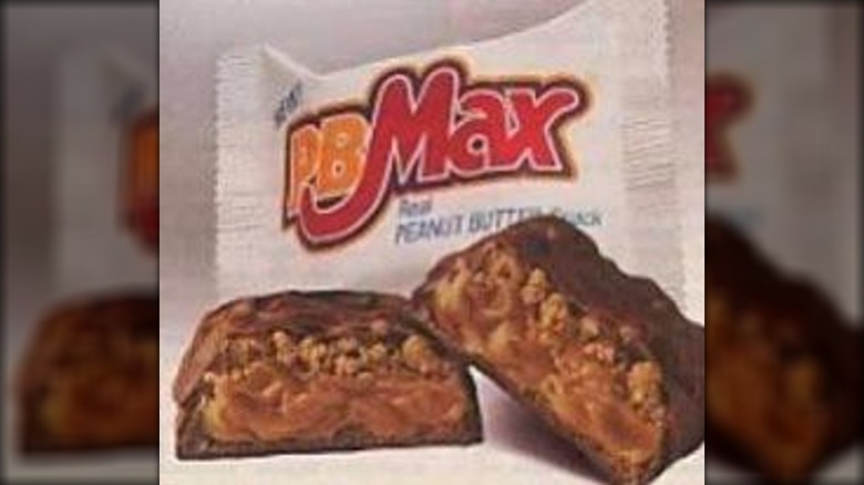PB Max candy bar split open, with wrapper in background