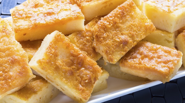 Butter mochi squares on a plate
