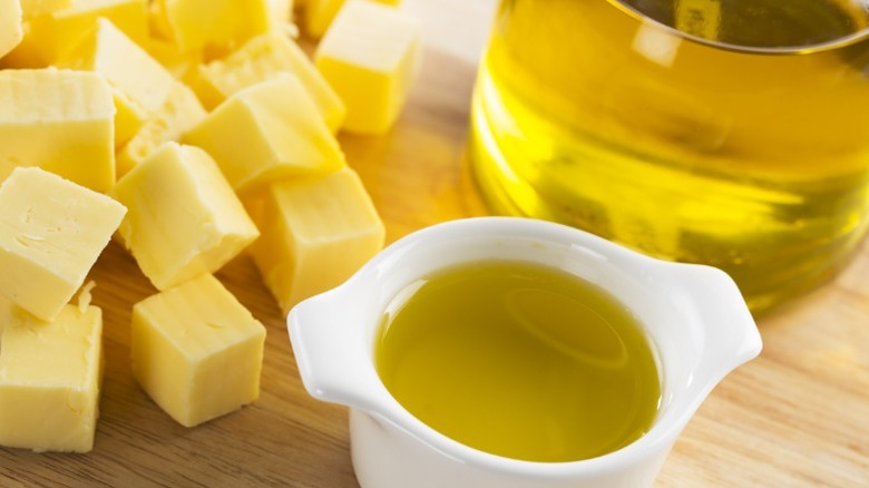 cubes of butter and containers of oil on a countertop